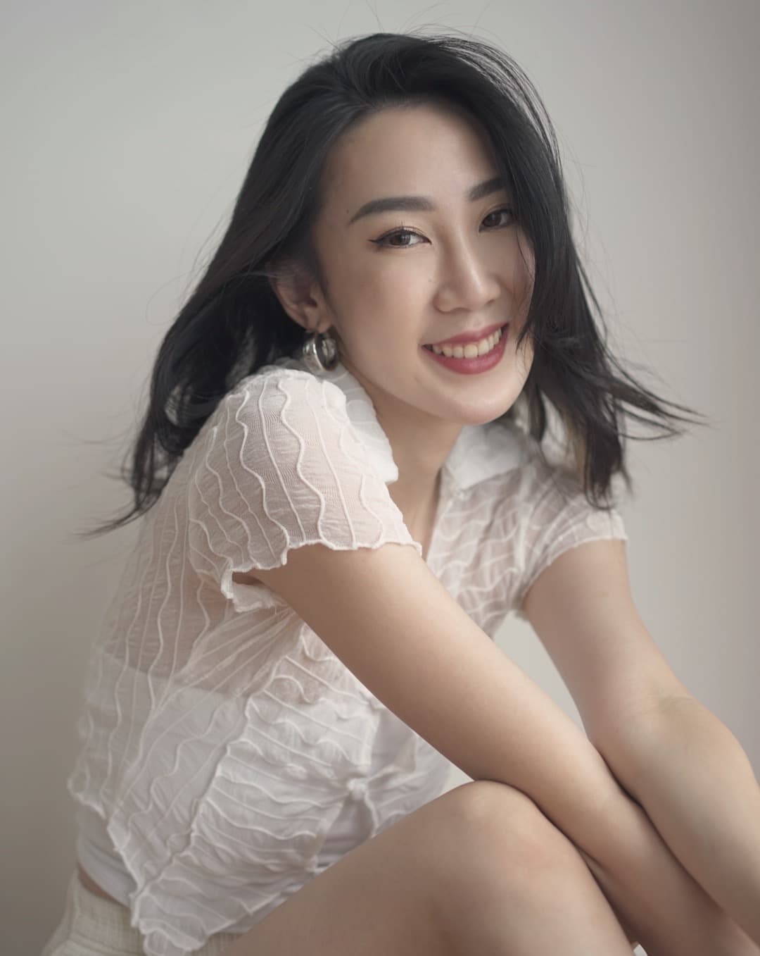 Pretty Girl Smiling With Invisible Braces On Top Of Bed In The Hotel Room