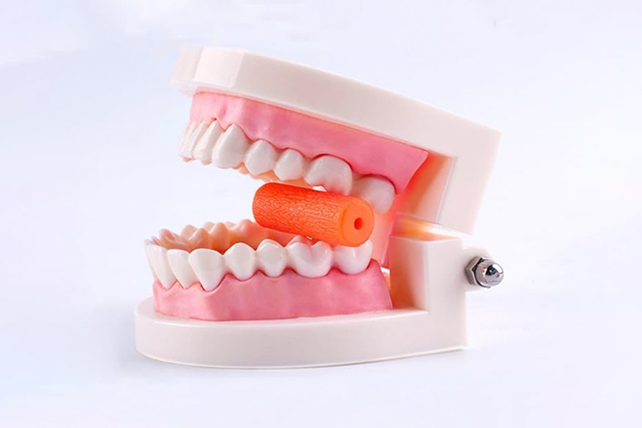 fake teeth biting on Invisalign chewie
